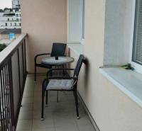 A balcony in a 3-room apartment with two chairs and a table, Žižkova, Košice - Juh district.