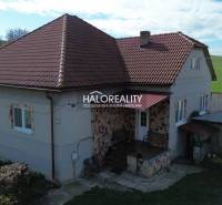 A family house in Rimavské Janovce with a red roof and a rural surrounding environment.
