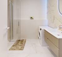 Bathroom with a washing machine, shower, sink, and mirror in a studio apartment with marble details.