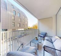 A balcony with chairs and a table in a studio apartment on Floriánska Street in Bratislava.