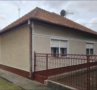 A family house in Radava on Hlavná Street with a red roof and white shutters.