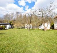 A spacious grassy plot with fruit trees for living in Raková.