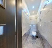 A bathroom in a 3-room apartment with modern sanitary ware and tiles.