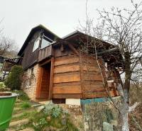 A cottage near Žilina with stairs, wooden paneling, and proximity to nature.
