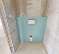 Toilet in a family house with prepared installation for tiles and equipment.