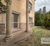 The exterior of the house with stone cladding and a small porch on Krčméryho in Bratislava - Staré Mesto.