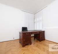 Office space with wooden furniture and a wooden decor floor in a 4-room apartment.