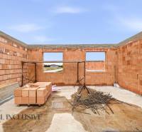 Construction of a family house in Veľké Dvorníky with brick walls and flooring.