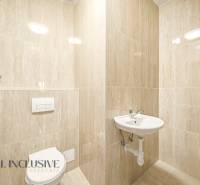 A bathroom in a family house with a white sink and toilet.