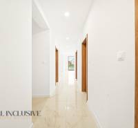 Interior of a family house with light walls and a gres floor.