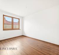 White wall and floor with wood decor in the room of a family house.