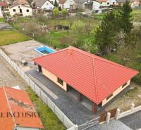 A family house in Horné Mýto with a swimming pool and a large garden surrounded by greenery.