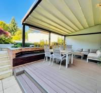 Terrace of a family house with seating and a pergola on Kozičova Street, Bratislava - Devín.