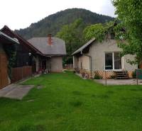 A family house in Blatnica on Blatnica Street surrounded by greenery with a view of the forest.