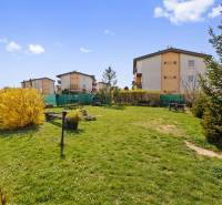 Garden with lawn and shrubs in Most pri Bratislave on M. R. Štefánika Street.