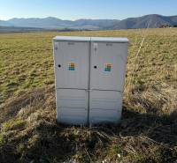Electrical switchboards on residential plots in Borie in Stránske, green meadows, mountains.