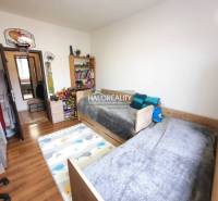 Children's room with wood-decor flooring in a 3-room apartment.
