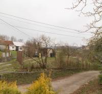 A country family house in Kostoľany nad Hornádom, surrounded by nature and a paved road.