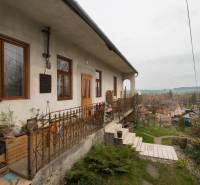 A family house in Kostoľany nad Hornádom with a terrace, garden, and a view of the surroundings.