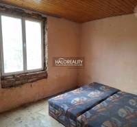 Room with a bed, unfinished walls, and a wooden ceiling, category Land - housing.