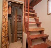 Wooden stairs leading to the upper floor, interior of the Recreational Grounds.