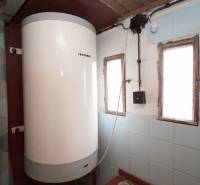 A boiler in an interior with blue tiles on recreational grounds.