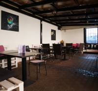 Comfortable seating in cozy gastro spaces with art on the walls.