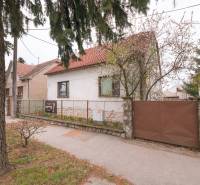 A family house on Zelenečská Street in Trnava with a front garden and a gate.