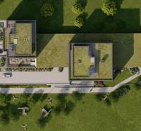 An aerial view of the roofs and surrounding park of a trio of buildings on Suchoňova Street in Poprad Juh.