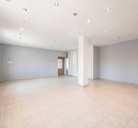 Commercial premises with white walls, ceramic flooring, and spot lighting.