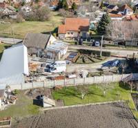 Commercial premises in Okoč with surrounding houses in a peaceful rural area.