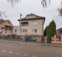 Liberators Street, house with a 2-room apartment, Trenčín, with fences and trees.