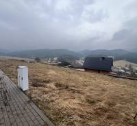 Plots - housing in Stará Ľubovňa with a view of the hills and rooftops.