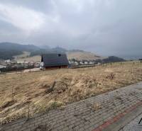 Foggy view from residential plots in Stará Ľubovňa with a house and trees.