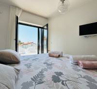 Bedroom in a villa with a view, bed, and television, ideal for relaxation.