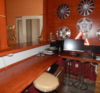 Interior with a bar and hubcap decoration on the wall in gastronomy spaces.