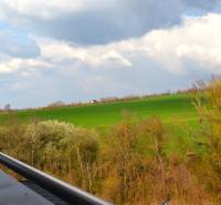 View from a 2-room apartment to the green fields in Podhájska in Svätuša.