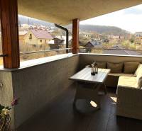 Furnished terrace of a 2-room apartment with a view of the surrounding countryside of Podhájska, Svätuša Street.