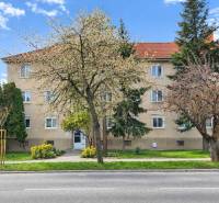 An apartment building on Dukelská Street in Bernolákovo with three floors and surrounding greenery.