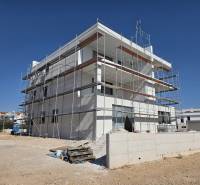 A building in SRIMA with scaffolding, work is being done on a 3-room apartment.