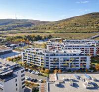 A view of residential buildings on Malokrasňanská Street in Bratislava - Rača surrounded by greenery.