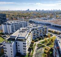 Aerial view of residential buildings with a playground on Malokrasňanská Street in Bratislava-Rača.
