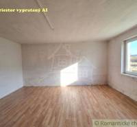 A room with a wooden decor floor in a family house.