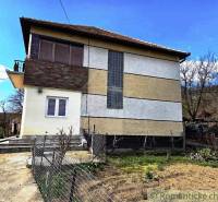 A family house in Kiarov with a balcony and a garden on a visible plot.