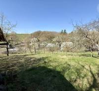 Gardens in Rimavská Sobota with lawns and trees, overlooking the surrounding landscape.