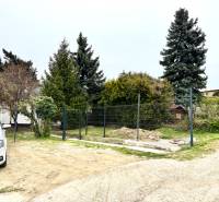 Family house on Podkerepušky Street in Bratislava - Záhorská Bystrica, with a car and trees.