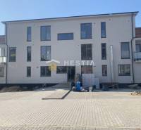 The picture shows a new building with balconies, suitable for a 2-room apartment.