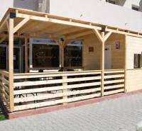 Wooden terrace in front of the café on Dukelská Street in Bernolákovo, suitable for gastro spaces.