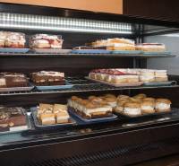 In the gastro area, various types of desserts are displayed in the refrigerator.
