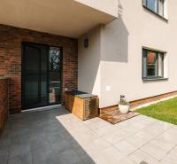 Terrace of a 4-room apartment on Cesta na Klanec in Bratislava - Lamač with a green lawn.